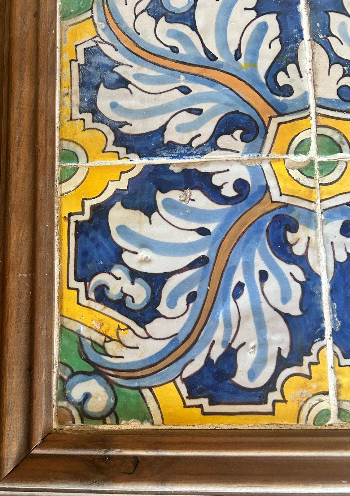 Panel of four Catalan tiles, 17th century, framed.