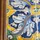 Panel of four Catalan tiles, 17th century, framed.