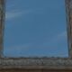 Chic and stylish old mirror with carved wooden frame in limed white and gold