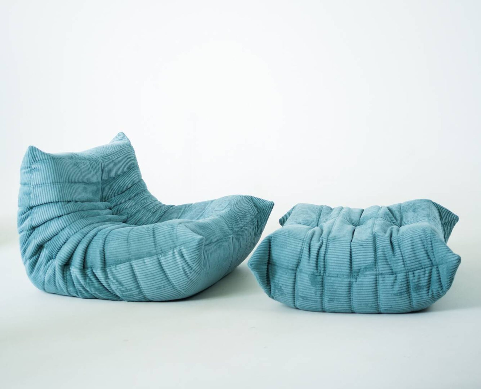 Togo set of armchair and pouf in light blue corduroy
