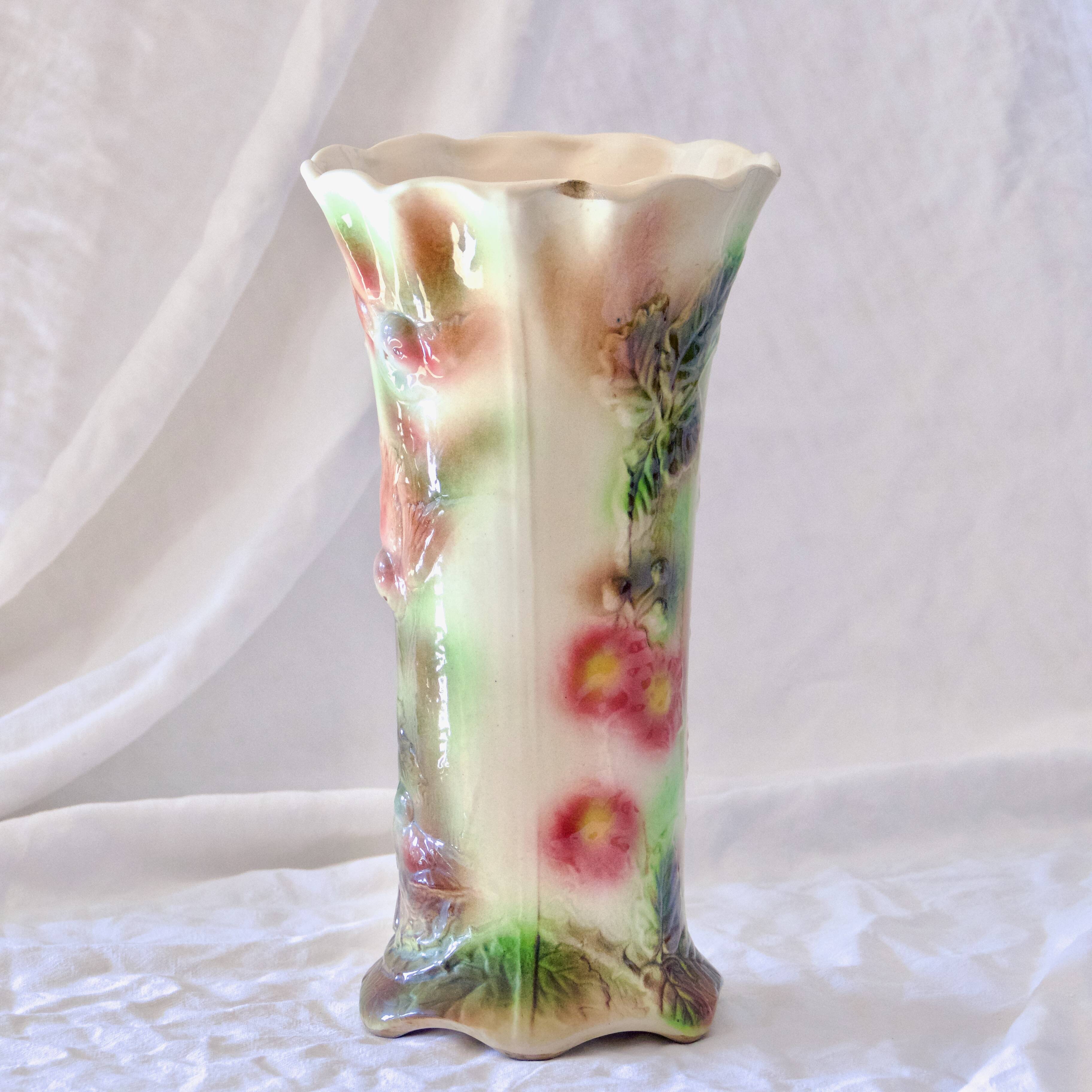 Antique Saint Clément slip roller vase with bird decor