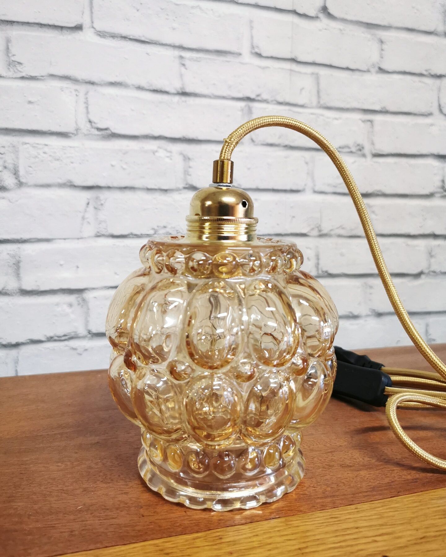 Old vintage hanging lamp stroller in moulded glass