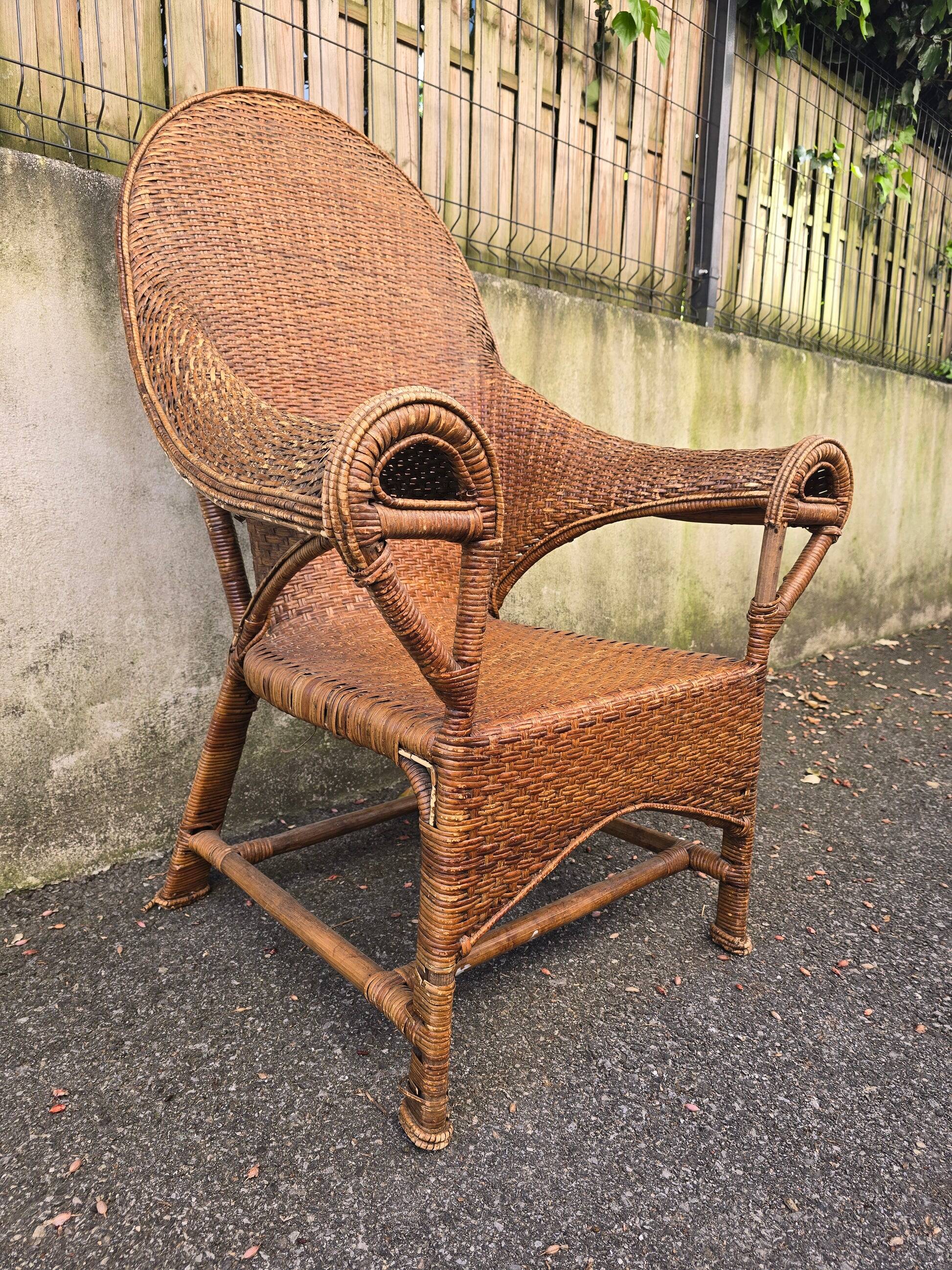 Arts & Crafts armchair in wicker and rattan attributed to Dryad & Co, UK, circa 1920.