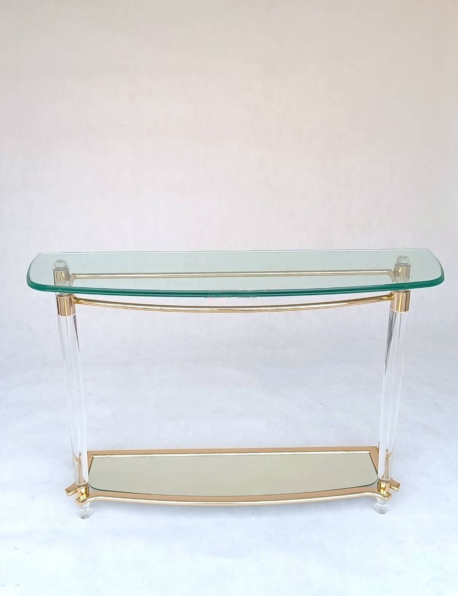 Hollywood Regency console table in lucite, glass and gold metal. 1980s