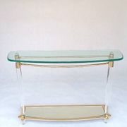Hollywood Regency console table in lucite, glass and gold metal. 1980s