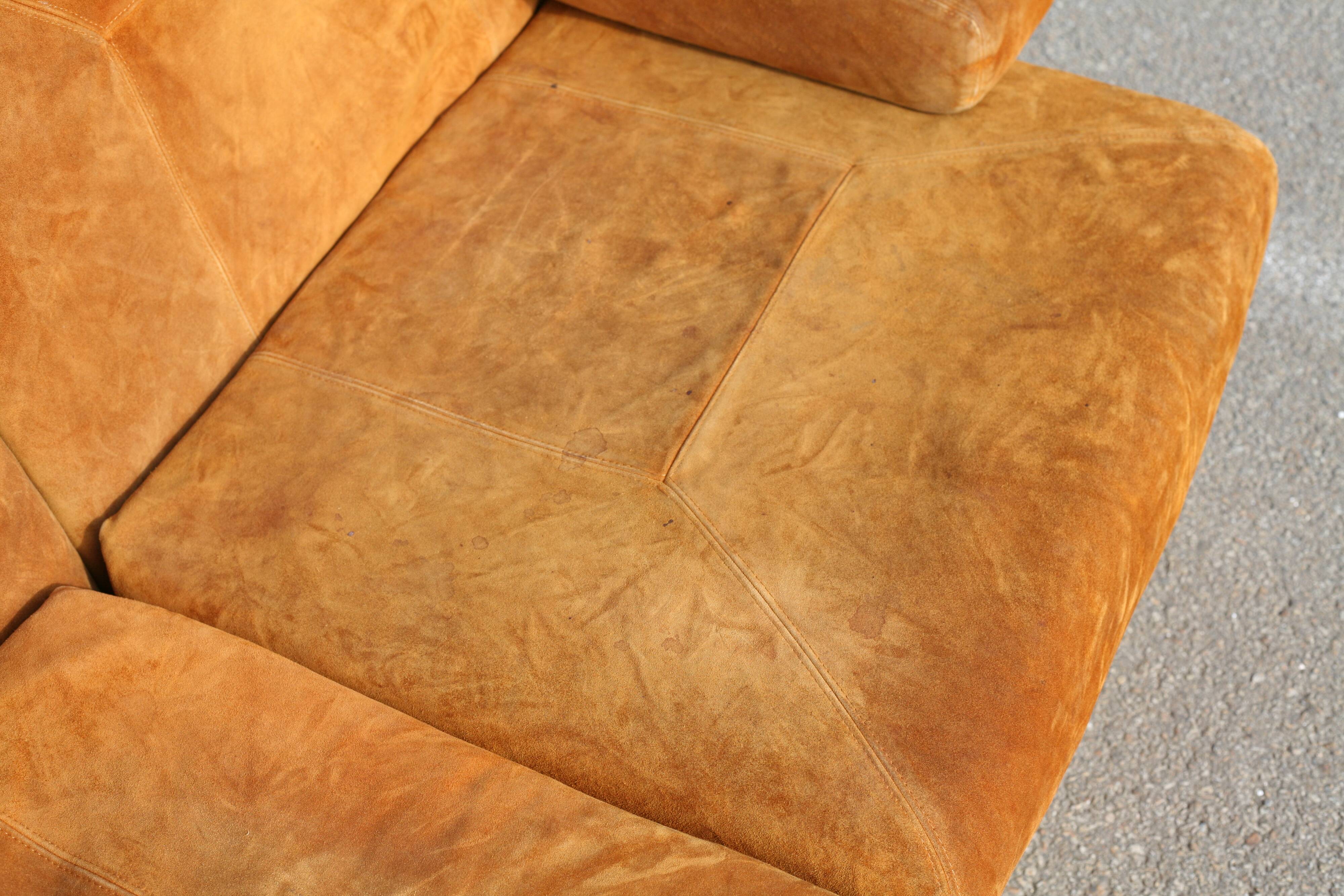 Orange suede leather and steel sofa. Circa 1970