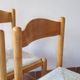 4 solid pine chairs, straw seats, shaped backrest.