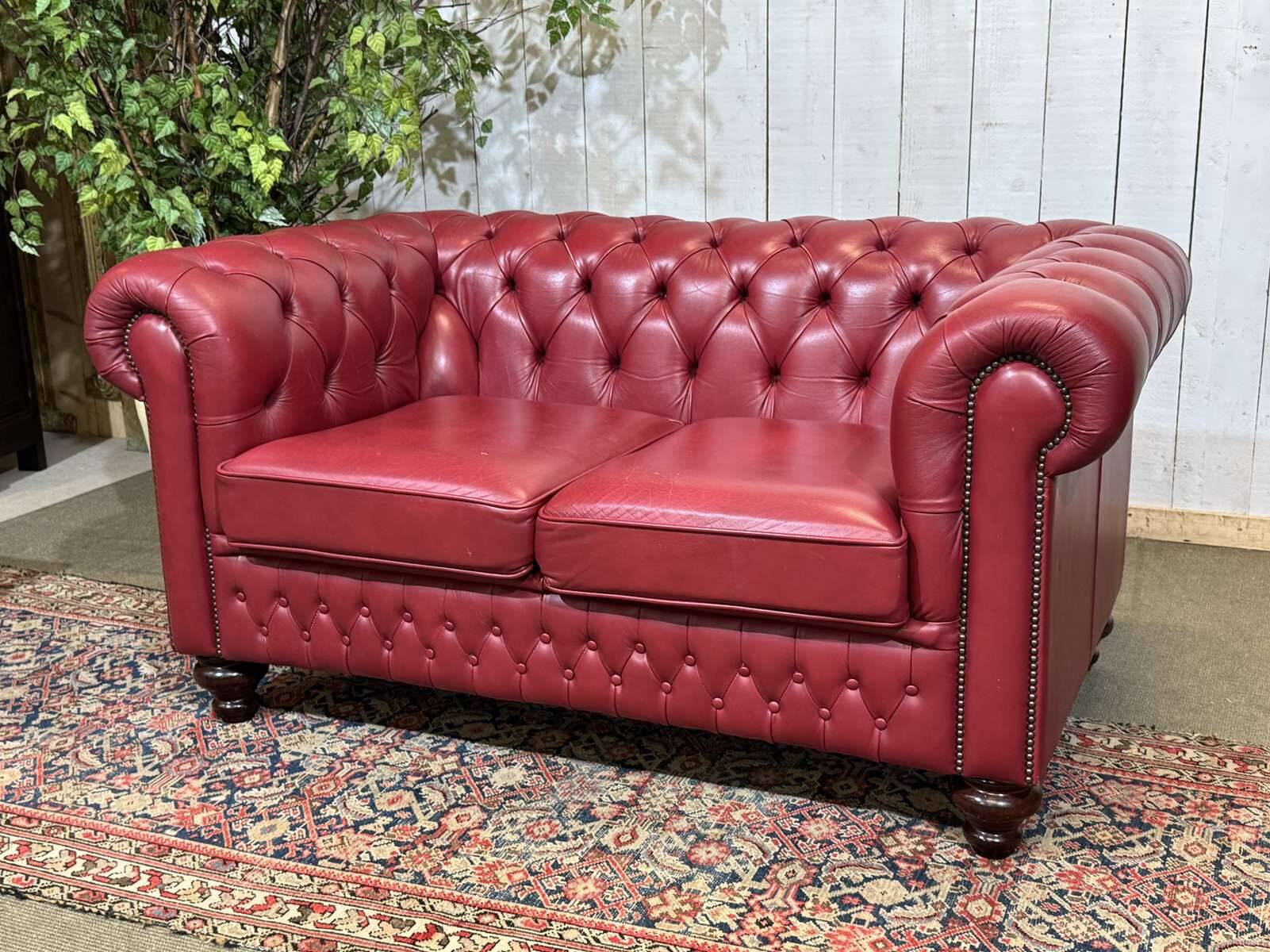 Chesterfield 2-seater leather sofa, modern production from the 2000s.