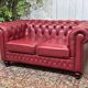 Chesterfield 2-seater leather sofa, modern production from the 2000s.