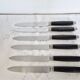Silver and ebony table knives, stainless steel blade, late 19th century.