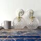 Pair of brass and glass wall sconces