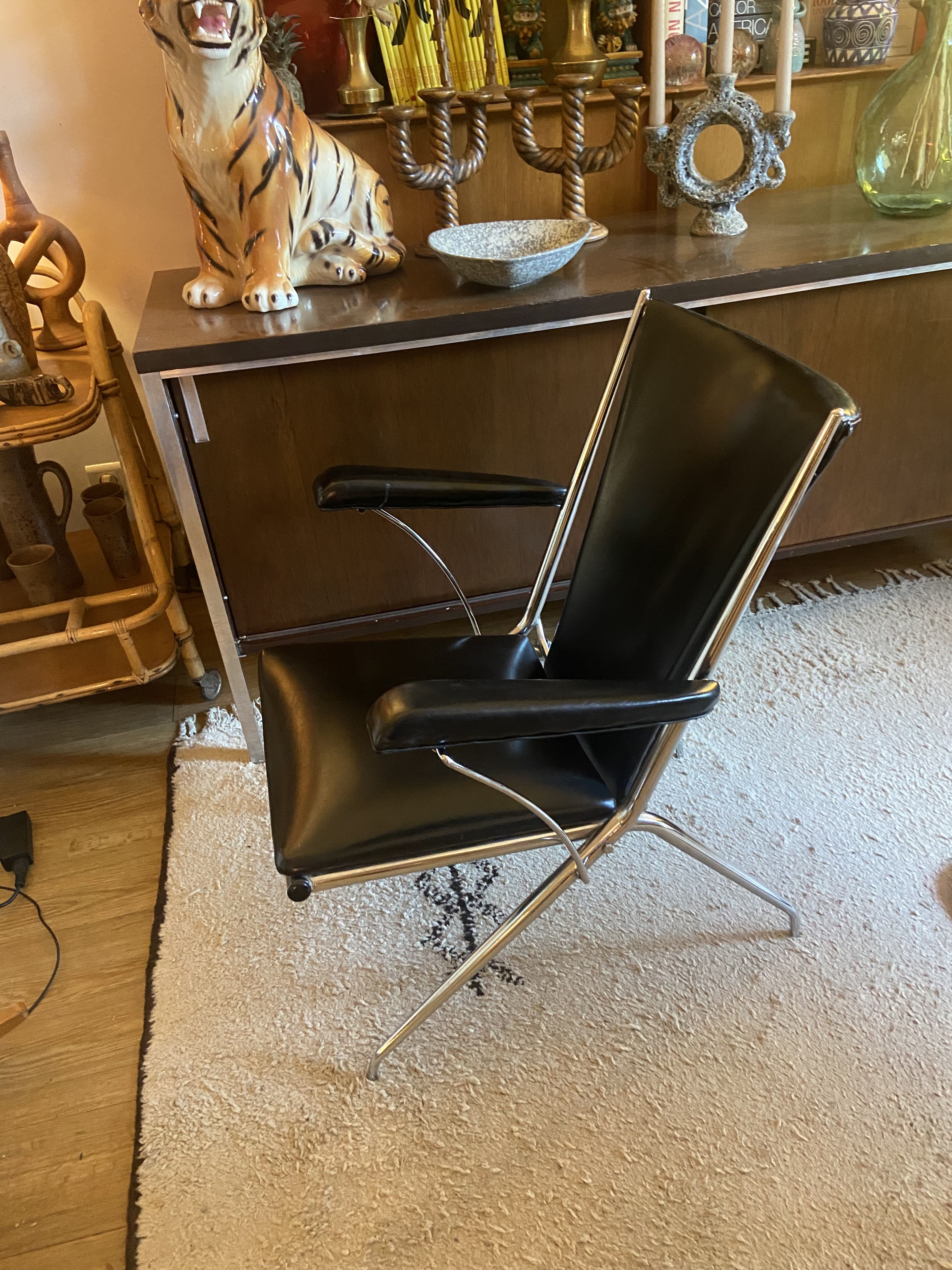 Metal armchair and black skaï