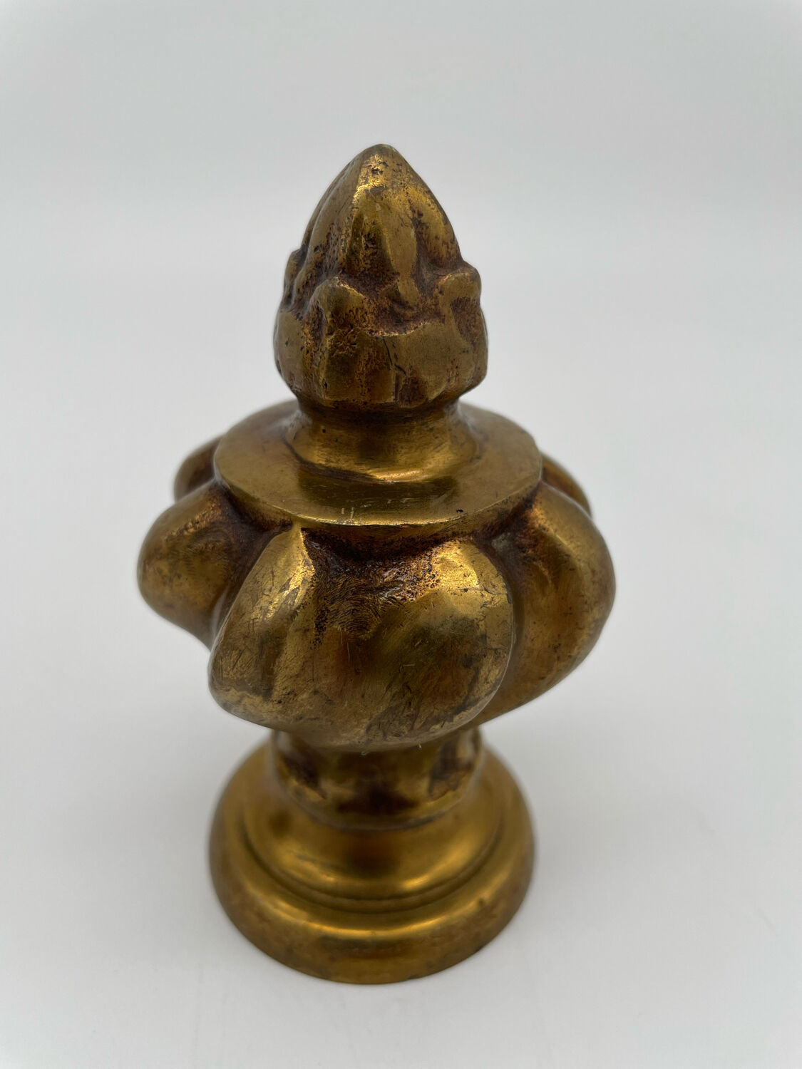 Pair of antique flame curtain rod finials in gilded bronze