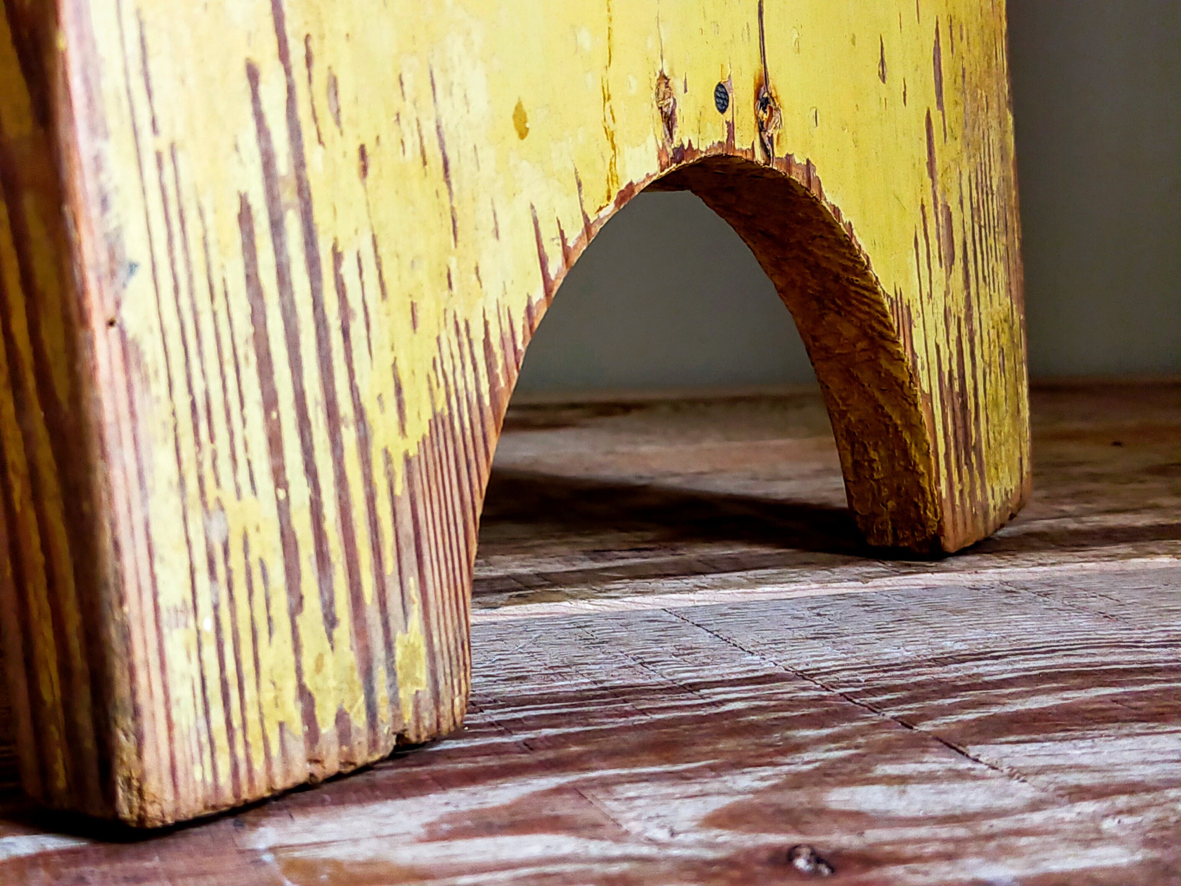 Art-populaire workshop stool in patinated wood