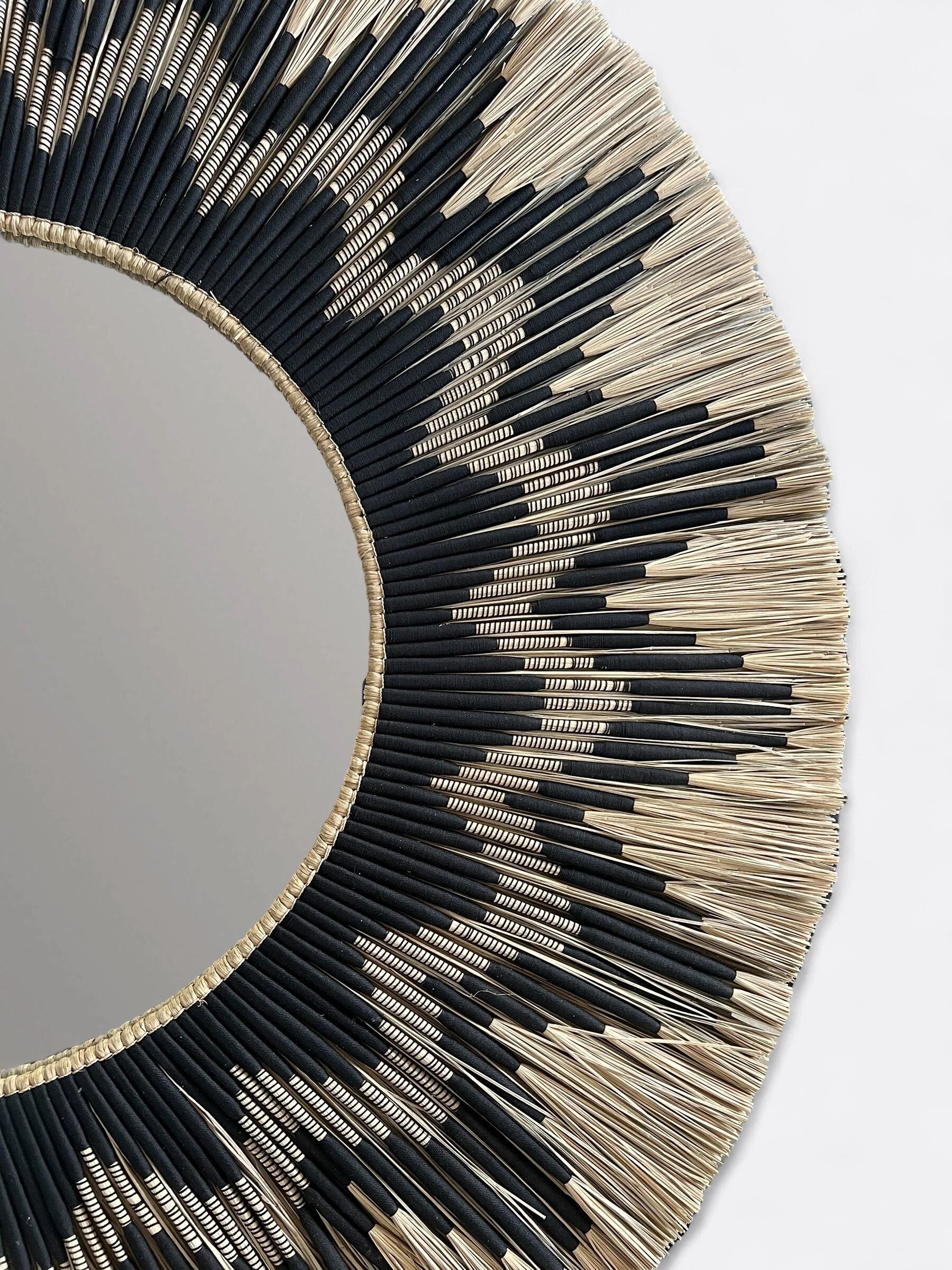 Large round handcrafted mirror in reed