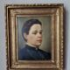 Oil on canvas portrait in an antique gilded wooden frame.