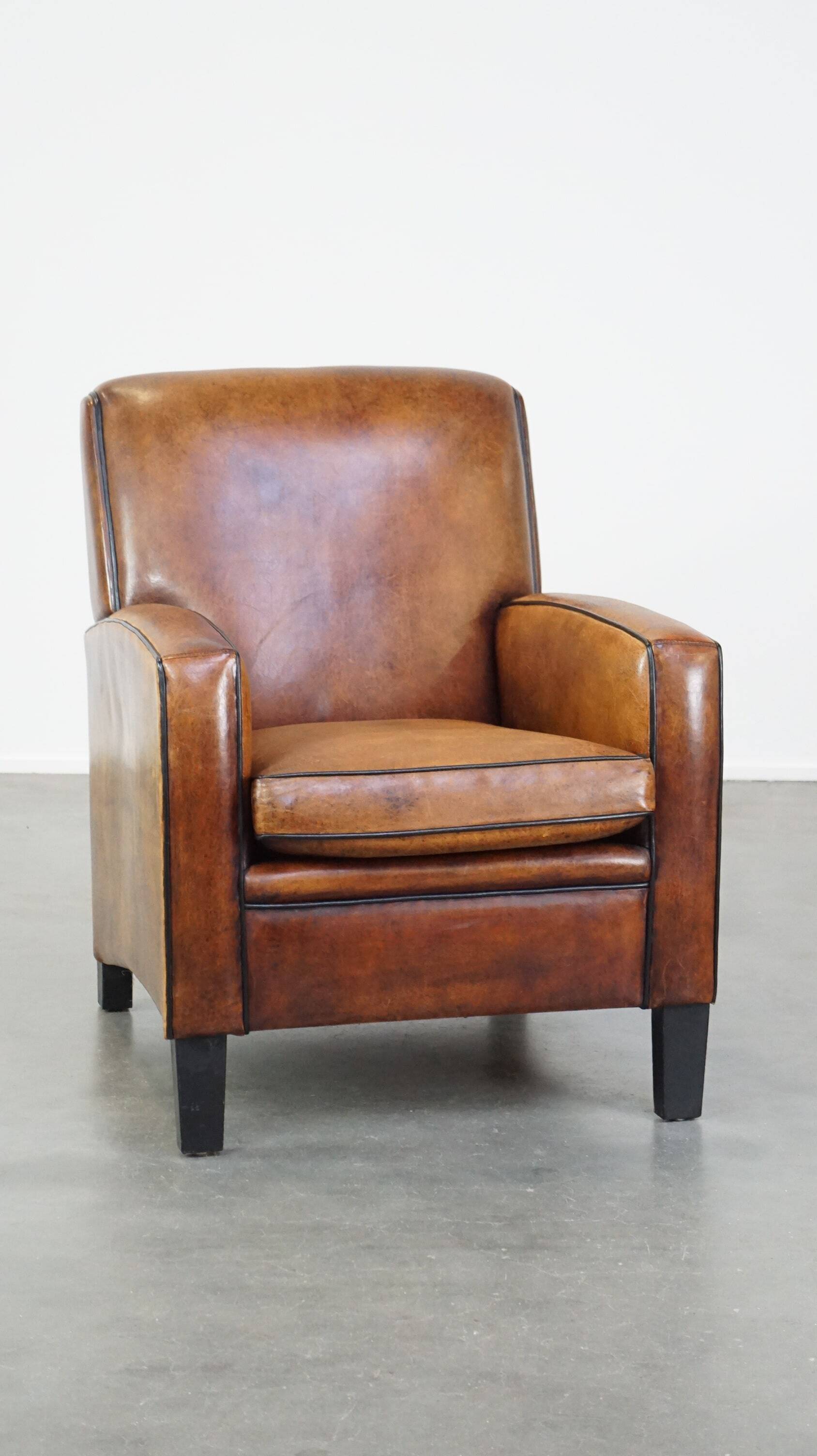 Art Deco sheep leather armchair with a lot of character