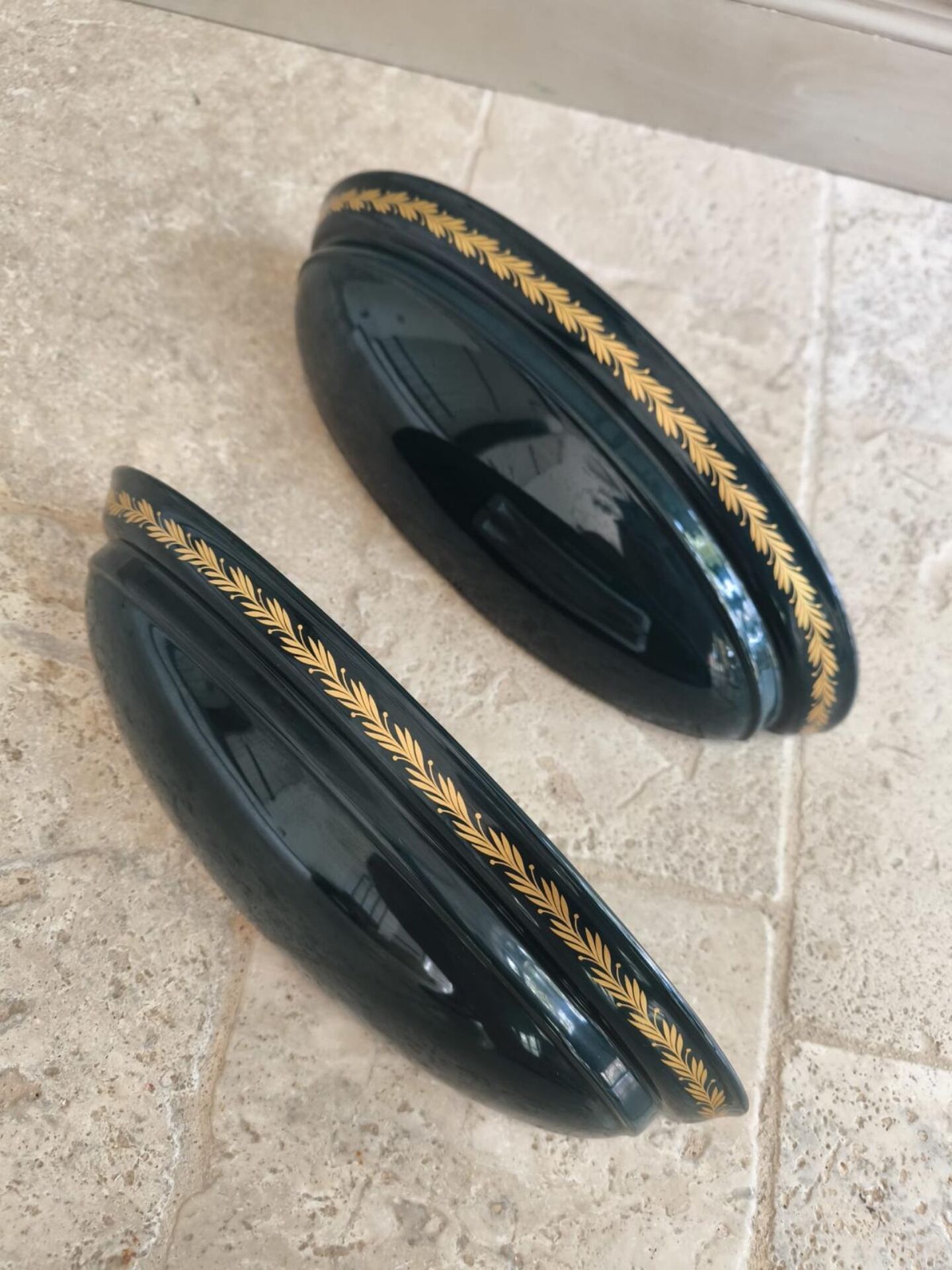 Set of two vintage wall sconces in pine green and gold.