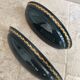 Set of two vintage wall sconces in pine green and gold.