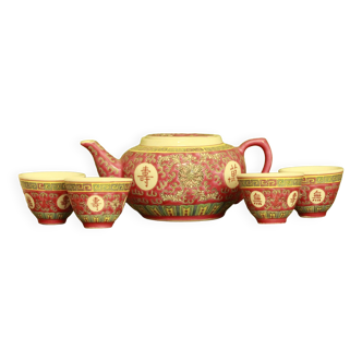 Chinese pink mu shou teapot and its cups