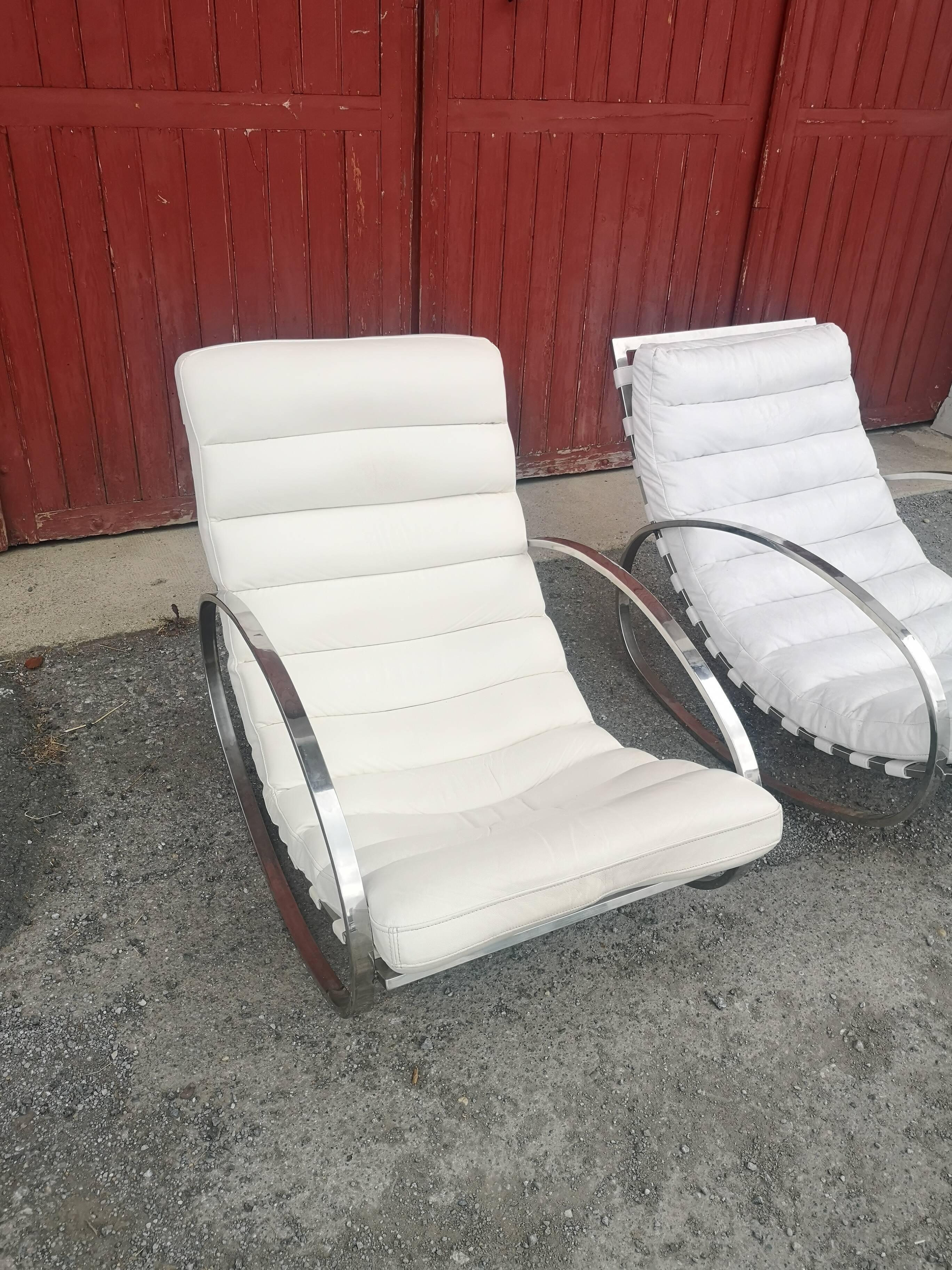 Pair of vintage chrome and leather rocking chairs