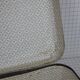 Cardboard and brown leather case