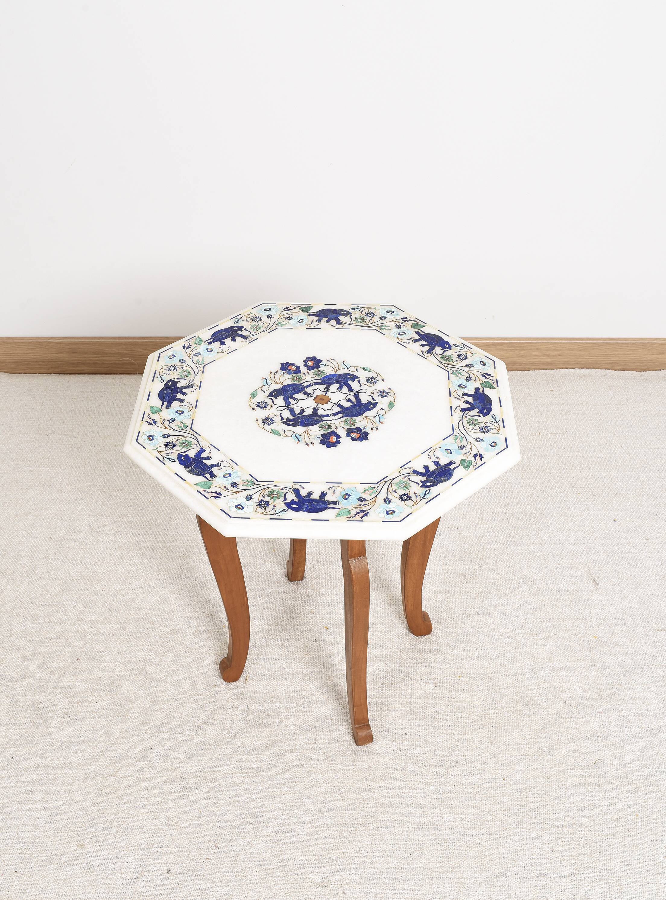 Side table with marble top and inlaid stones