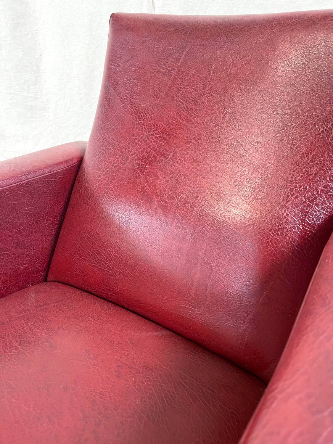 Vintage burgundy armchair, compass base in black metal and brass