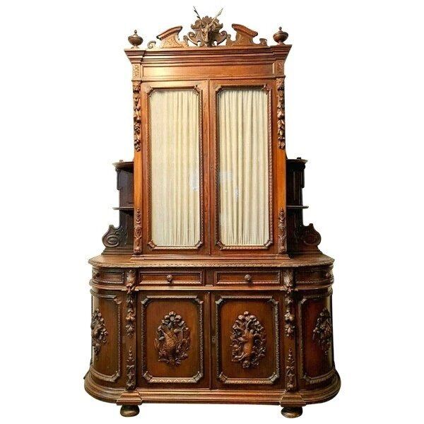 Important two-body buffet from a hunting lodge in carved walnut, Renaissance style.