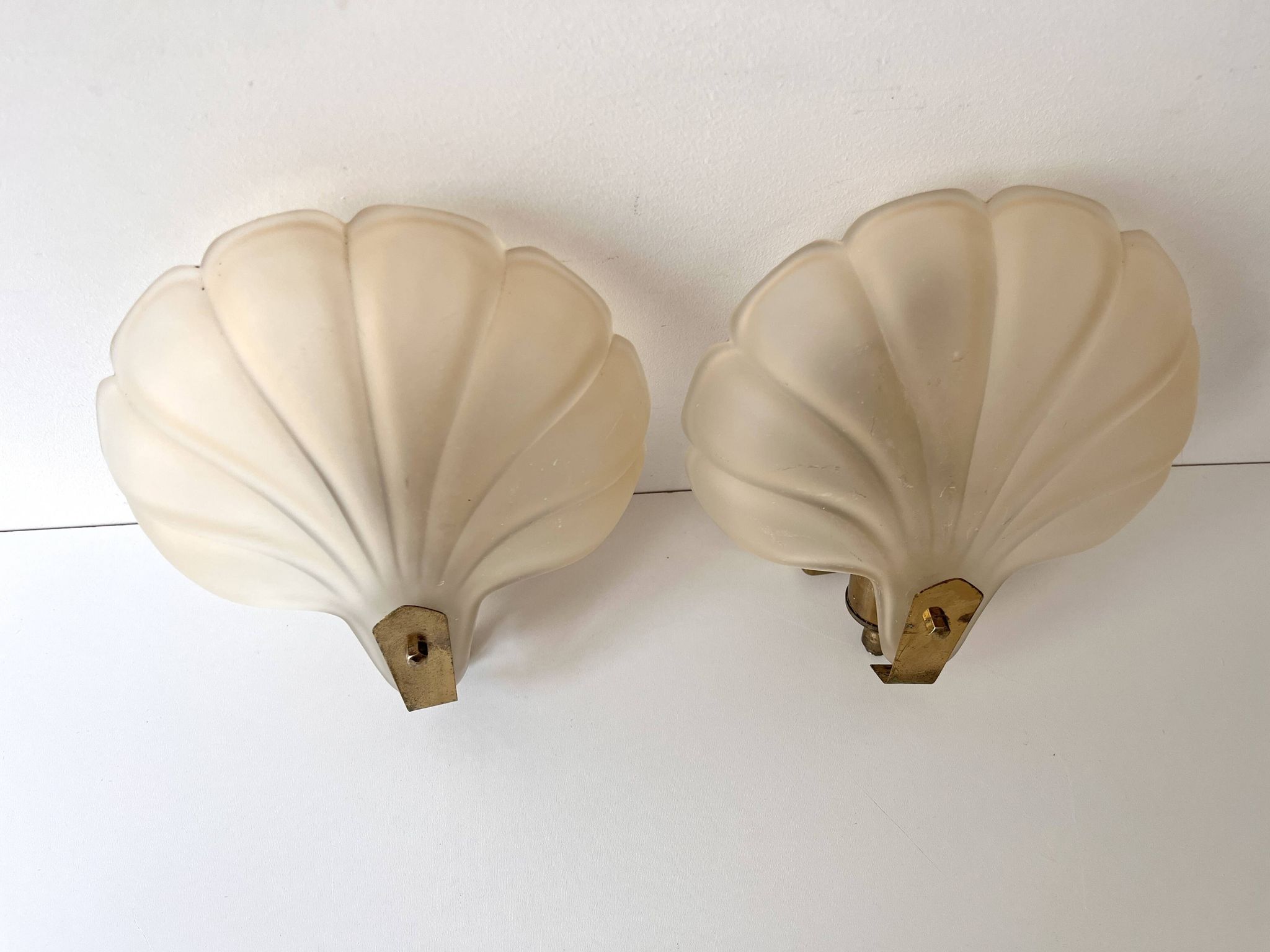 Pair of vintage shell glass wall lights, Art Deco style fixtures.