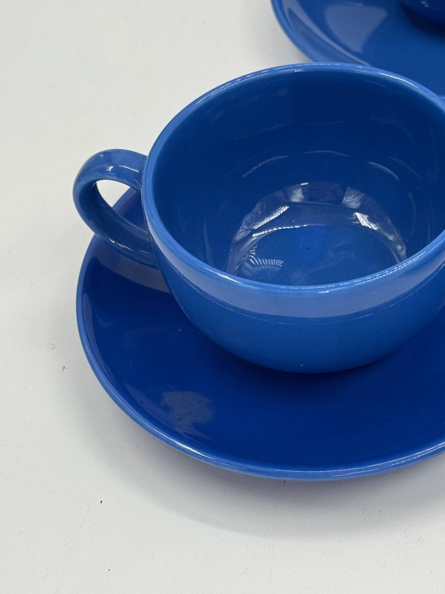 Set of 4 vintage blue ceramic cups and saucers.