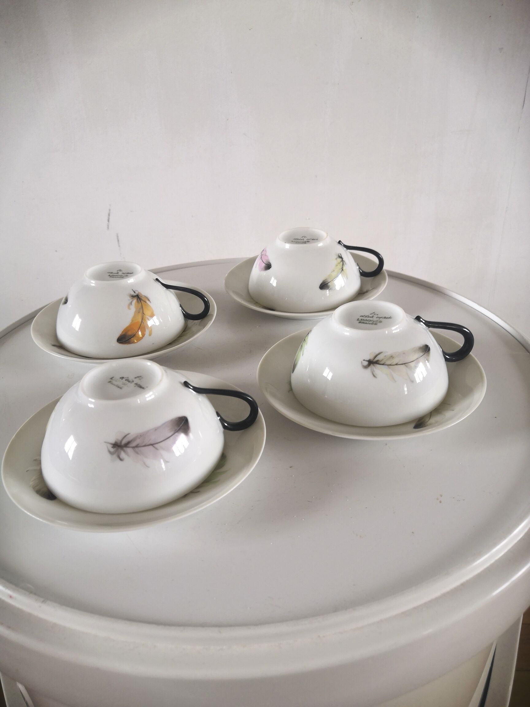 4 cups and cups in fine Limoges porcelain signed LC 60s