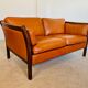 Canapé vintage danois des années 60 en cuir cognac pour 2 personnes.