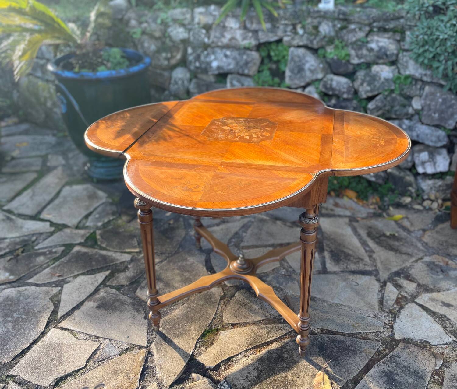 Center table decorated with marquetry of leaves and flowers in Louis XVI style, 19th century period