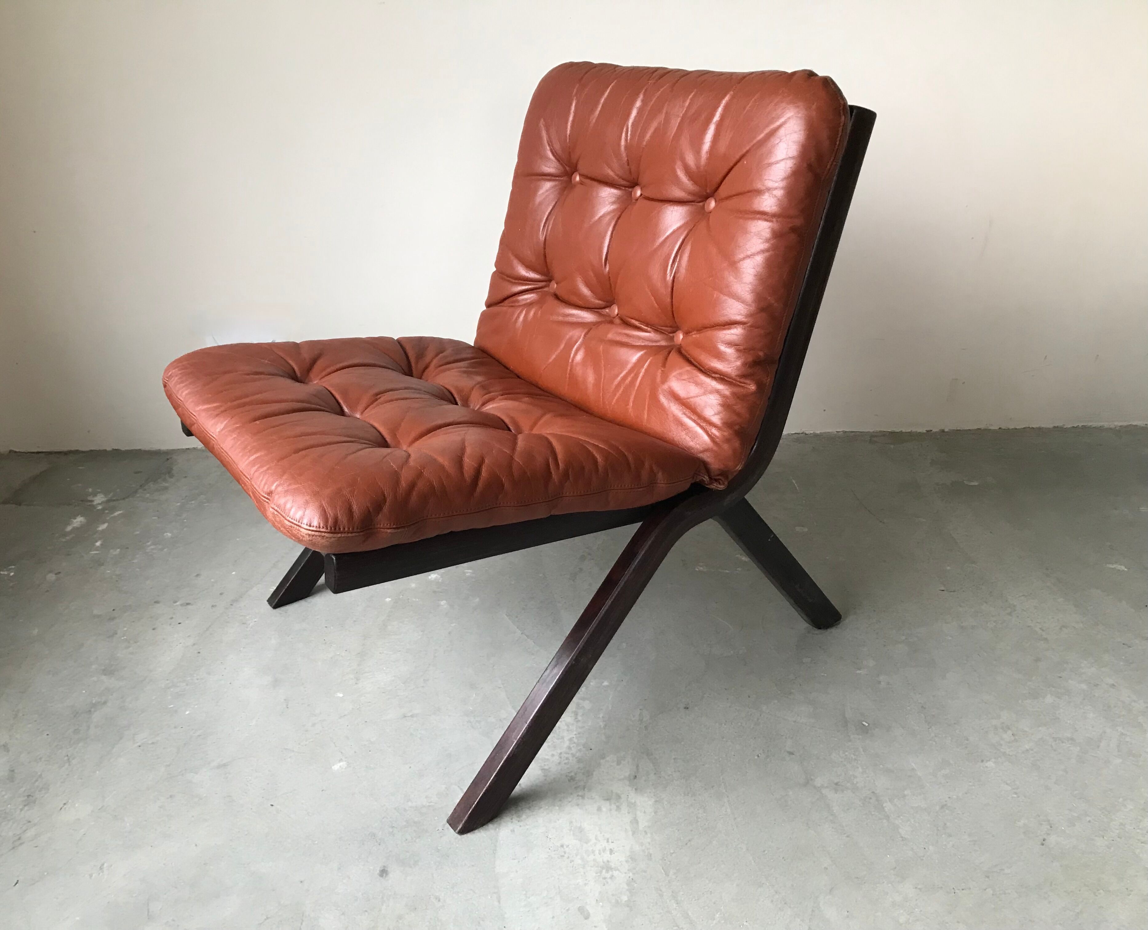 Scandinavian folding armchair in cognac leather
