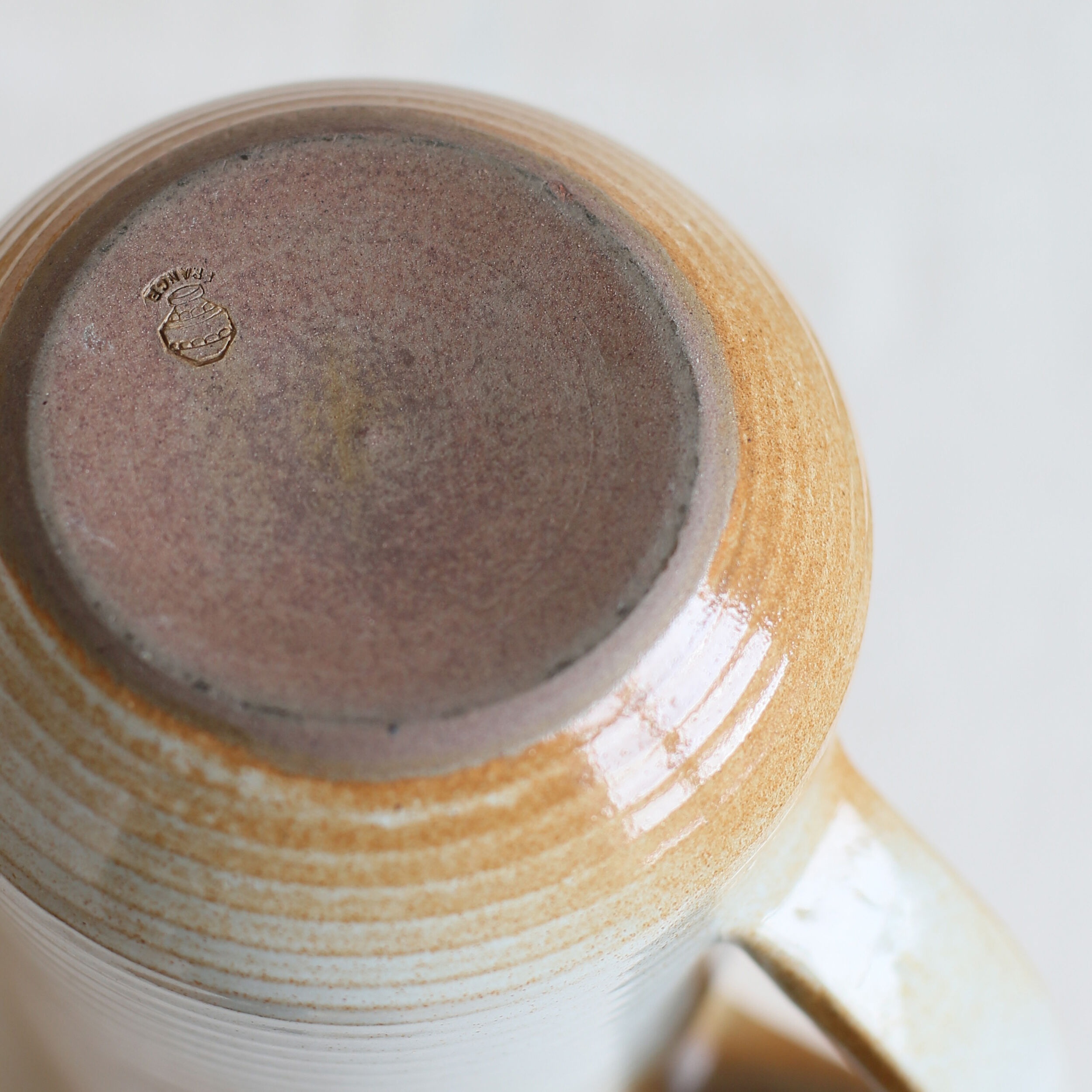 Enamelled sandstone pitcher