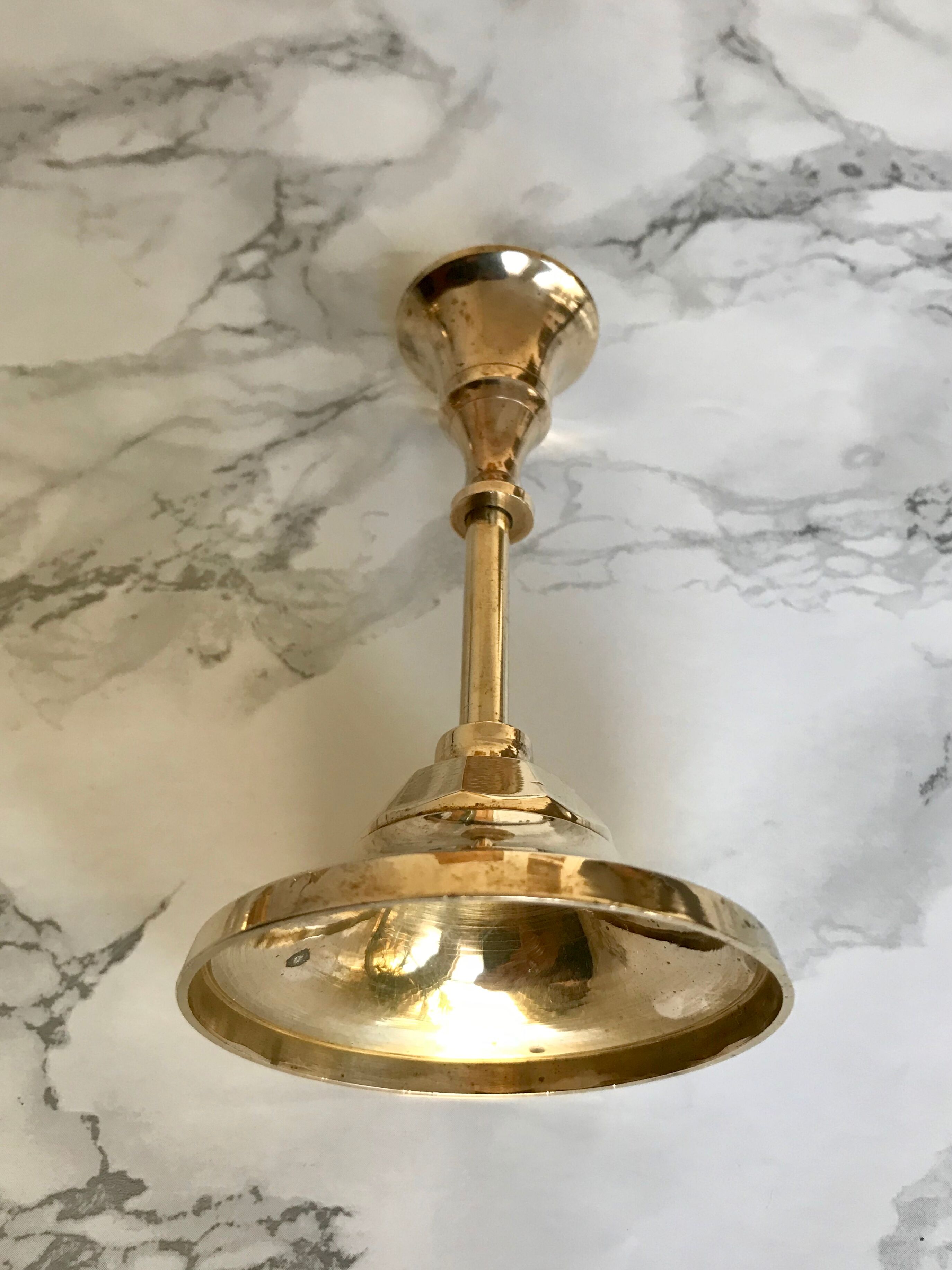 Set of three candlesticks in brass