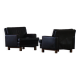 Pair of modern Danish lounge chairs in dark brown leather and rosewood, 1960s.