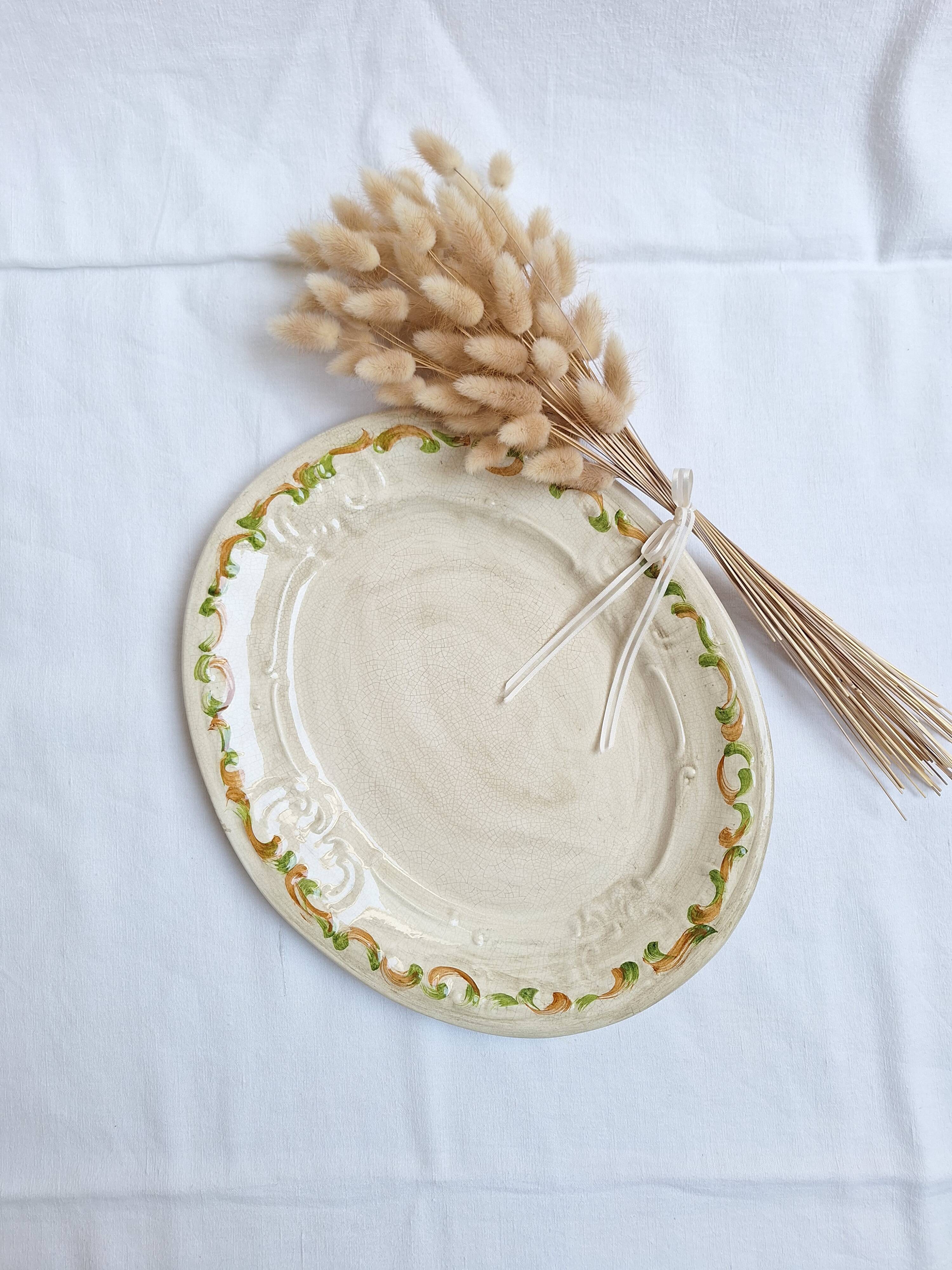 Oval plate, hand-painted meat platter in orange and green.