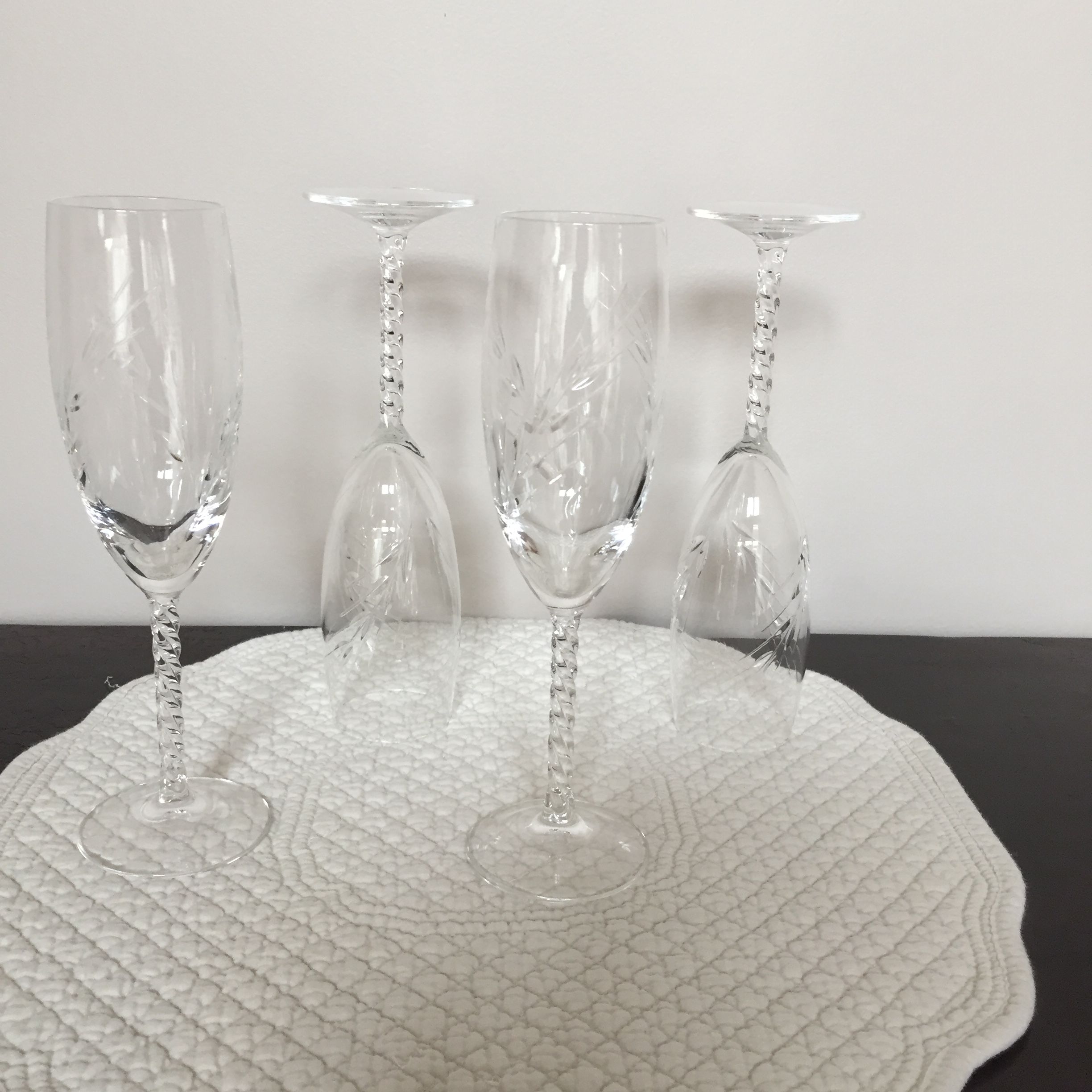 Four crystal champagne flutes engraved wheat cob patterns