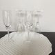 Four crystal champagne flutes engraved wheat cob patterns