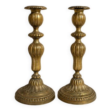 Pair of antique brass candlesticks in Louis XVI style, 19th century.
