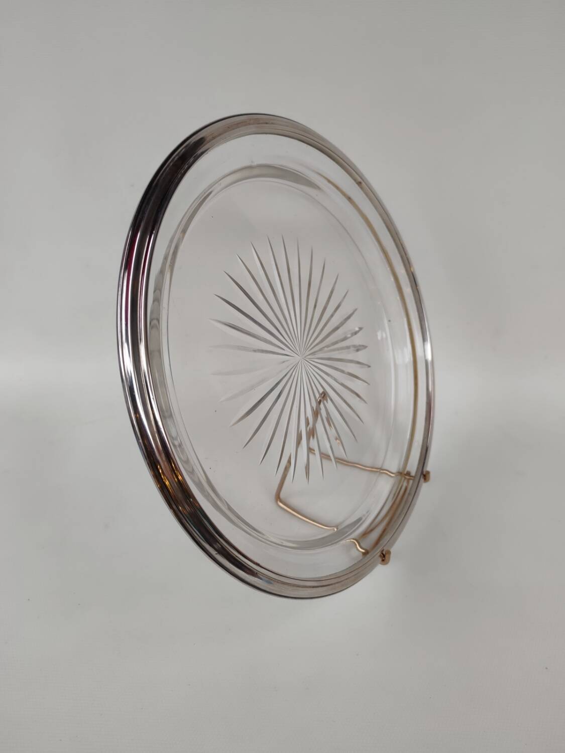 Cut crystal tray and solid silver rim.