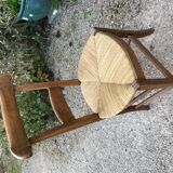 Solid oak table with 3 extension cords, 6 oak chairs with straw seat