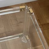 2 side tables in plexiglass, glass, and brass.