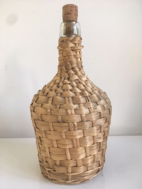 Old lady-jeanne dressed in vintage rattan