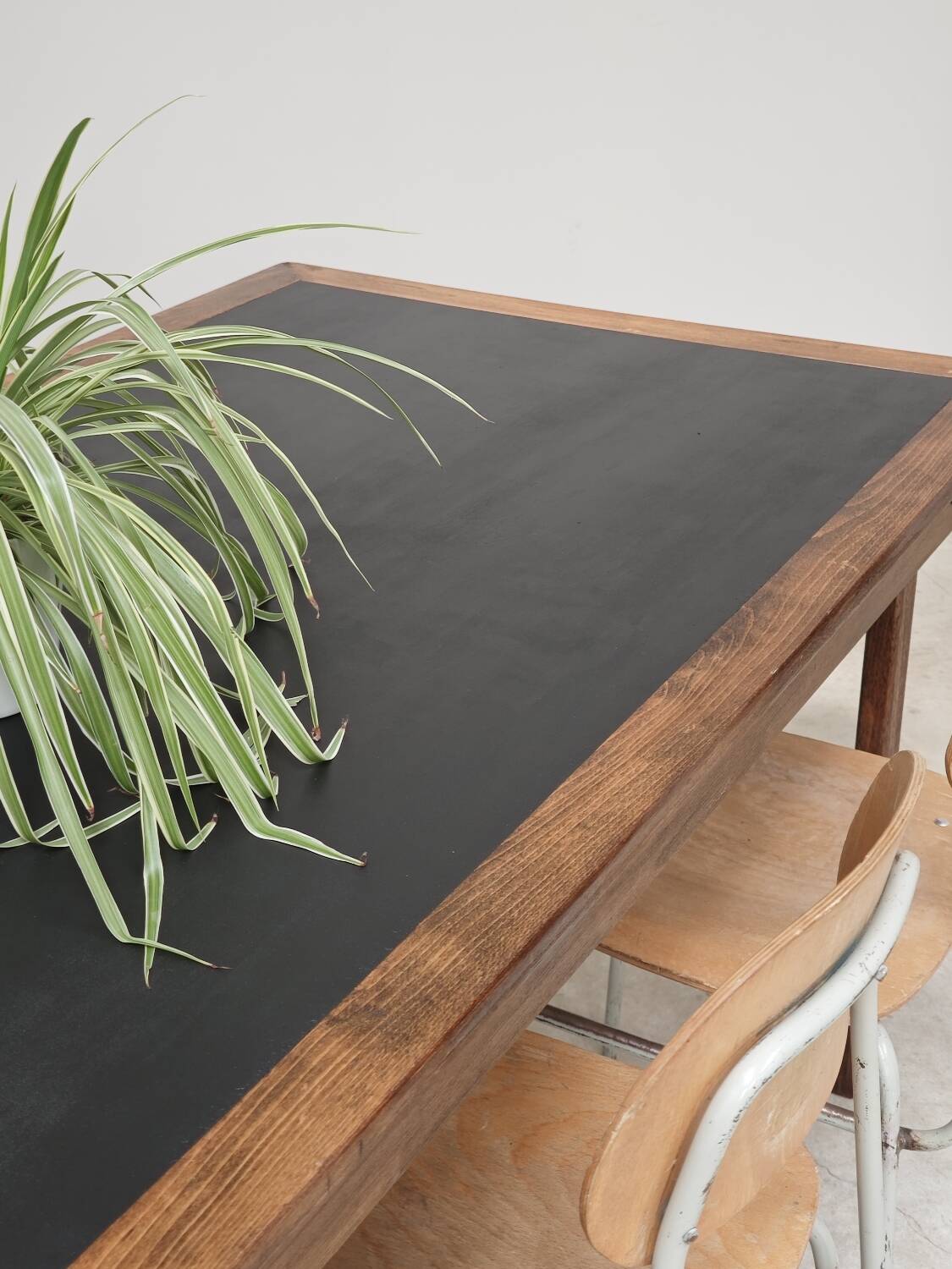 Vintage workshop folding table in oak with a hand-patinated black top.