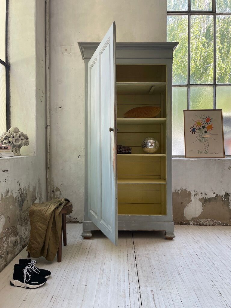 Blue patinated cap cabinet