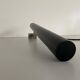 Minimalist black metal wall light with a cylindrical design, 1960s, Germany.