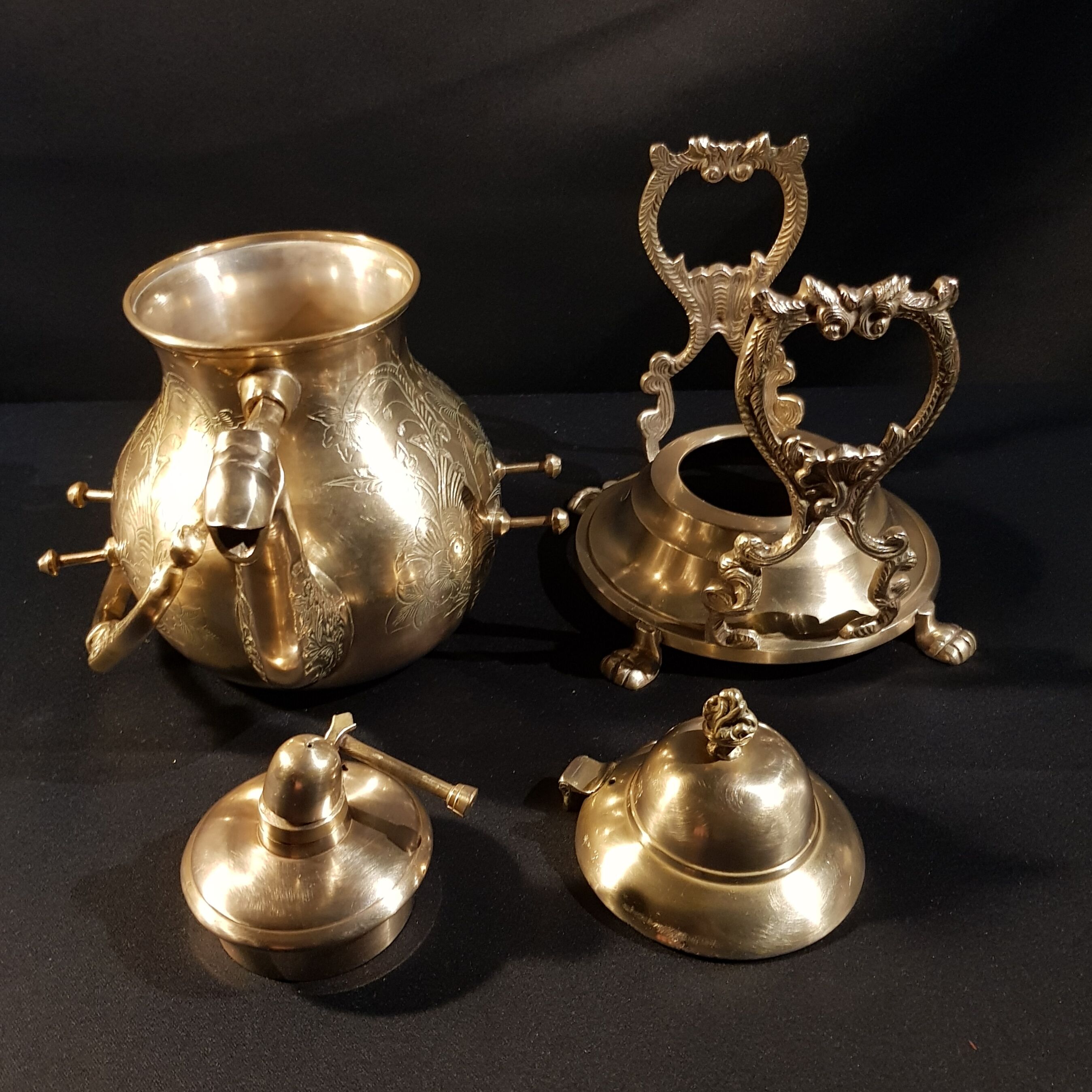 Oriental teapot on its support